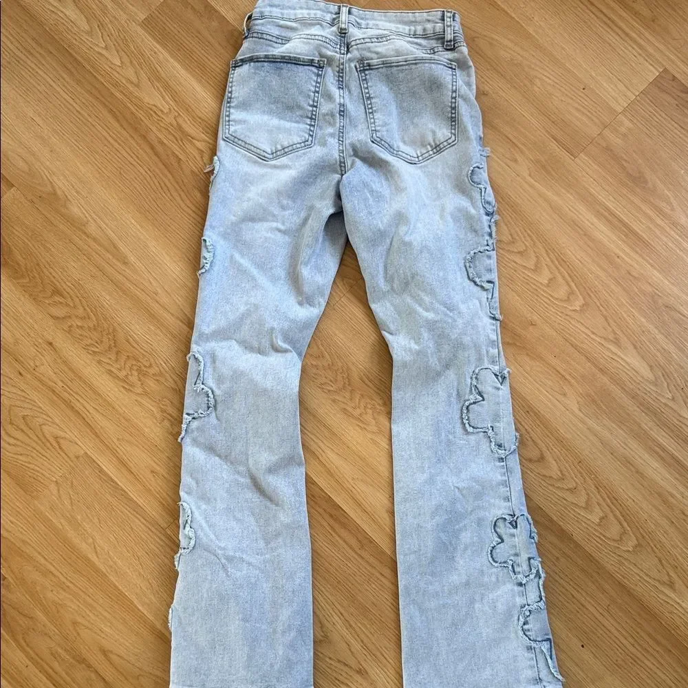 Stylish Light Blue Women's Jeans with Floral Accents Size 0 or 24 Flare Leg